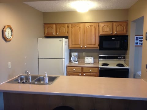 Kitchen has place settings for 16 and a full complement of cookware