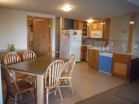 Cozy Full Kitchen + Eating Area with open floor plan adjoining living room