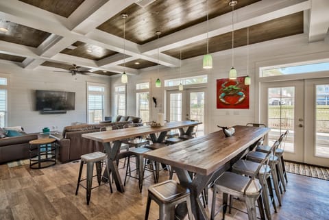 2 10-ft gathering tables, 2 sets of french doors lead to private pool