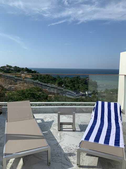 Roof-top deck with 4 sun-beds, 2 tables and 4 chairs. BBQ and shower area