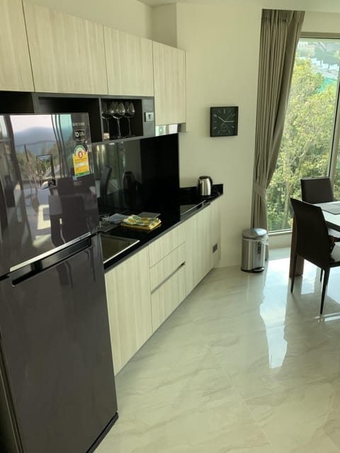 Kitchen with refrigerator and all appliances necessary to cook your small meal