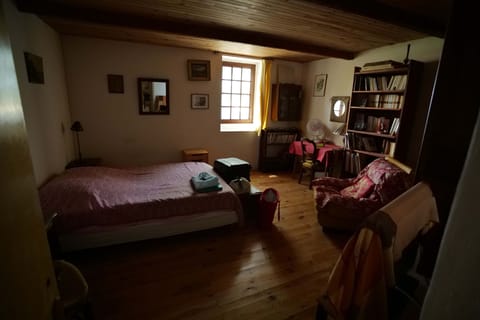 Ground floor bedroom (behind the living room).