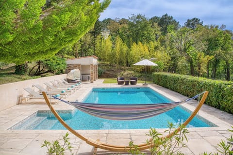 Stunning pool area with sun all day. Sun loungers, chairs, daybed and hammock.