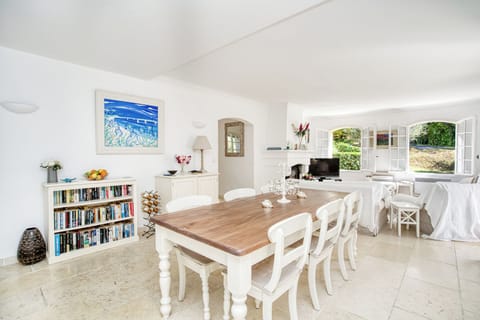 Dining area with French windows leading onto the terrace.
