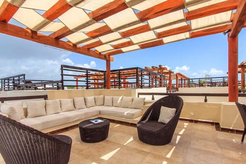 An amazing rooftop lounge under a shaded pergola w/stunning Caribbean views!