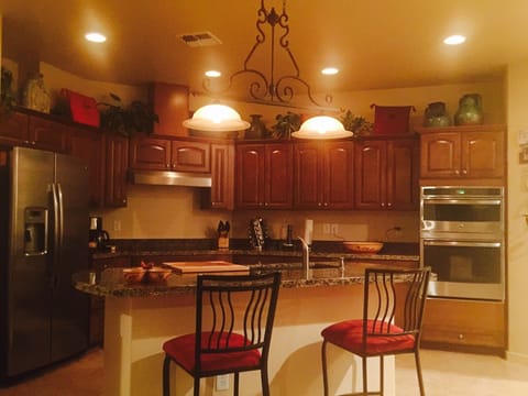 Kitchen counter with bar stools