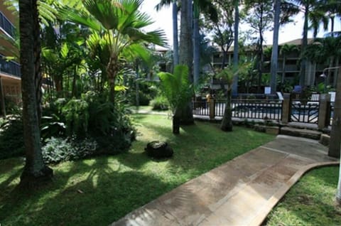 Lush Grounds and Pool Entrance