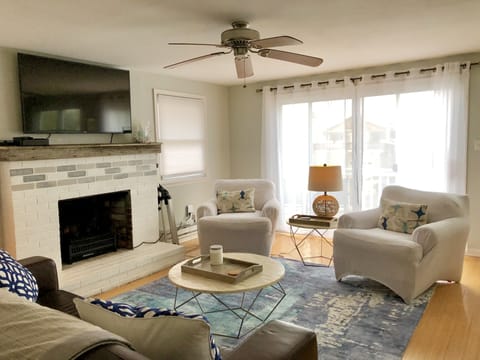 Light and airy living space features 55' 4K HD TV with XFinity Cable.