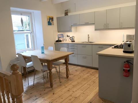 Kitchen with dishwasher. There are 6 chairs so the whole family can eat together