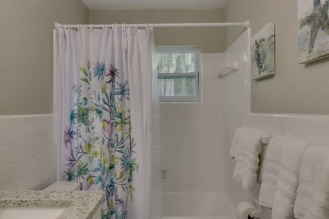 Combined shower/tub, hair dryer, towels, soap