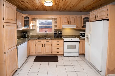 KI has granite counters, over-stocked w/ pots  &pans, microwave, dishes galore.