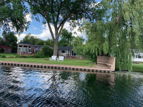 Docking for two boats at each house.