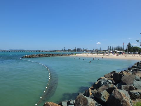 Short walk to Tuncurry rockpool, BBQ area, cafe, breakwall and beach.