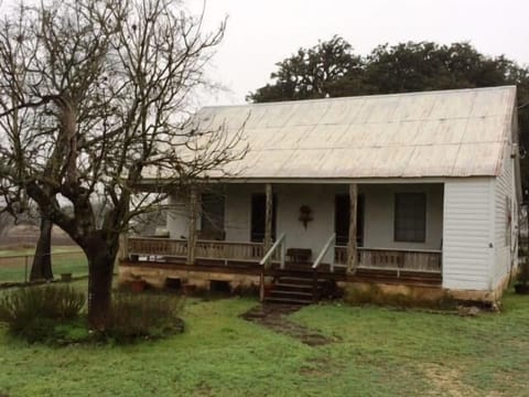 The outside of the farm house located on 70 acres!