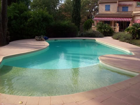 Beach area of pool , leading to main pool area 