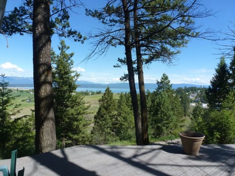 The view from the deck of Flathead Lake and the Mission and Swan Mountains. 