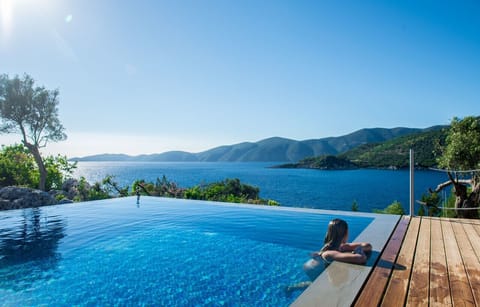 A heated pool, sun loungers