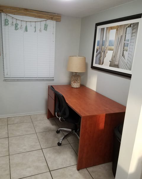 dedicated work space,  60" desk with two drawers and an office chair