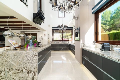 Main Kitchen area with double height ceilings.