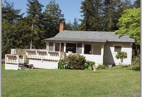One of two homes on acre plus, surrounded by trees and meadow with lots of sun.