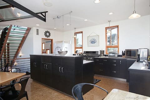 The open kitchen allows everyone to be together when preparing meals.