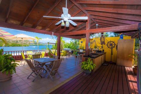 Adjoining outdoor kitchen terrace with bar, bbq & hammocks..above dock terrace..