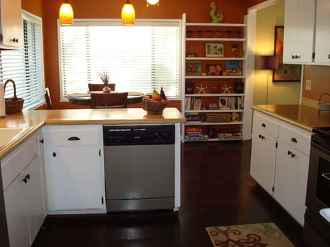 Another view of kitchen and adjoining breakfast nook