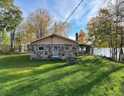 Welcome to the lake! Natural stone cottage w/ large yard & panoramic water views