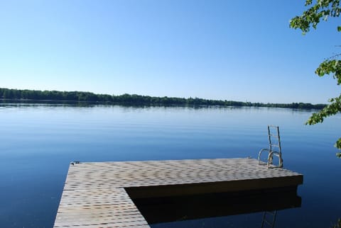 Deep-water dock w/ swim ladder provides great swimming area and room for a boat.