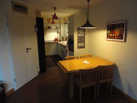 Kitchen with double door to front hall.