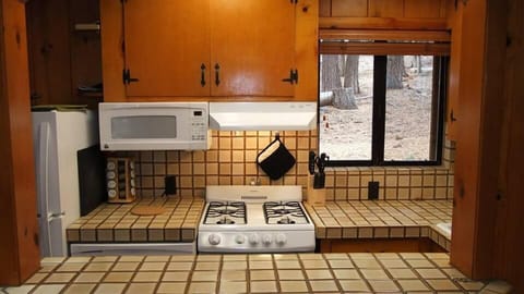 Kitchen view from Breakfast Bar provides 2 additional seats for dining.