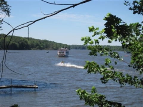 river view from the 1st floor showing a water skier and the River paddle boat