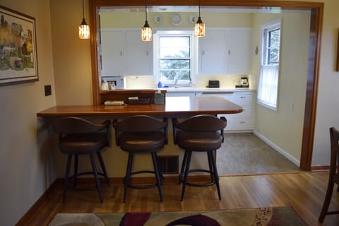 View from living room towards breakfast bar and kitchen.
