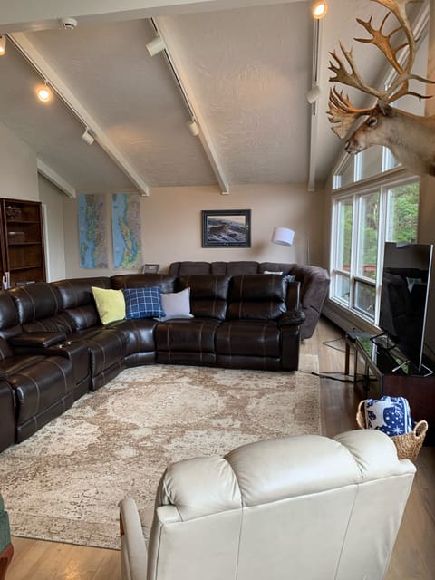 Great room, 75 inch TV and recliner seating 
