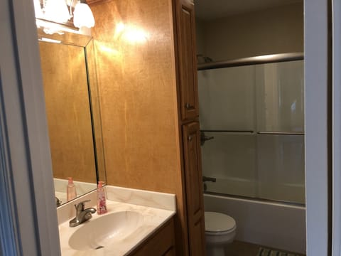 Combined shower/tub, hair dryer, towels, toilet paper