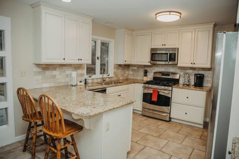 Kitchen shown from opening to Living room