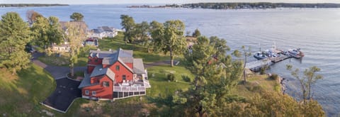 The Red cottage ---showing dock, boat house, main house, and view out the harbor