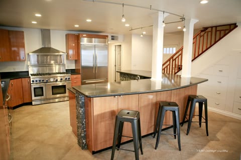 Spacious gourmet kitchen with bar seating for five