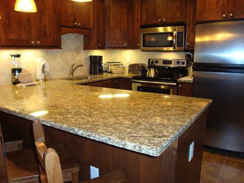 Stainless steel appliances and granite counter tops