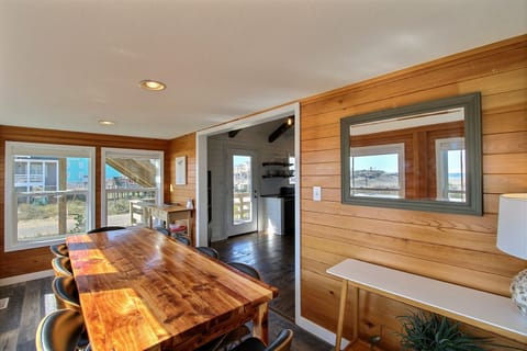 Custom local red cedar dining table with seating for 10 and ocean views