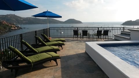 Large terrace and dipping pool with view of the bay