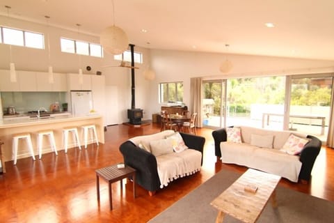 Large living area that leads onto outdoor decks