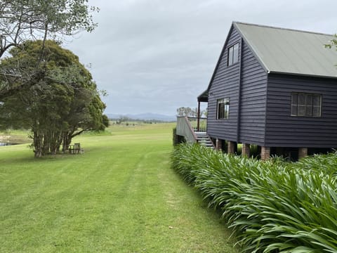 The Cottage has stunning views across grazing land to the Great Dividing Range