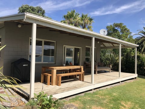 Large outdoor table for whole family, with Weber BBQ - all under cover