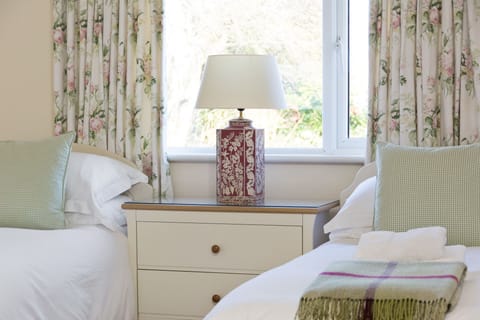 The Cotton Room  Twin bedroom overlooking attractive water garden 
