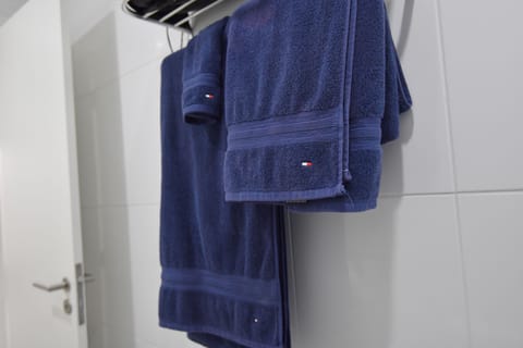 Shower, hair dryer, bathrobes, towels