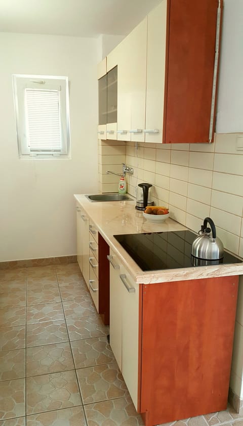 Fridge, electric kettle, cookware/dishes/utensils