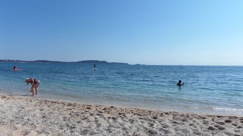 On the beach, sun loungers