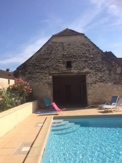 A heated pool, sun loungers