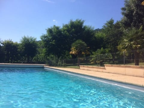 A heated pool, sun loungers